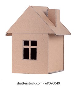 The concept, the house from the goffered cardboard, isolated on a white background