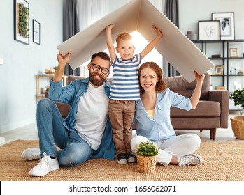 concept housing a young family. Mother father and child in new house with a roof at a home