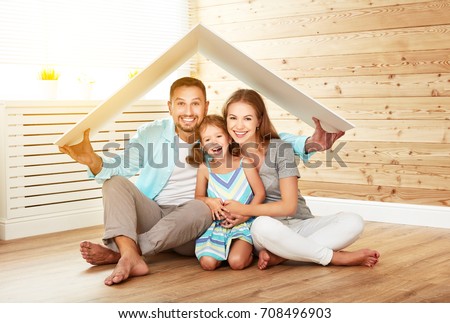 concept housing a young family. Mother father and child in new house with a roof
