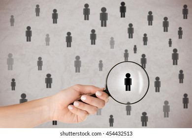 Concept Of Human Resources Selection. Hand Holding Loupe Selecting A Candidate.