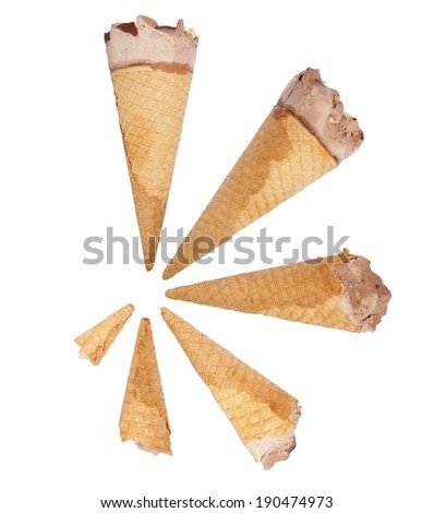 concept ice cream cone with chocolate and hazelnut isolated on white, with clipping path
