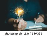 Concept Idea and Artificial Intelligence. AI, machine learning, Abstract, People holding Glowing colorful brain circuit in light bulb processing, deep learning, innovation Science and technology.