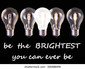 concept idea be the brightest, five lamp bulb halogen with different luminosity against black background