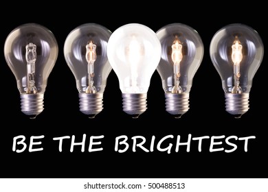 concept idea be the brightest, five lamp bulb halogen with different luminosity against black background
