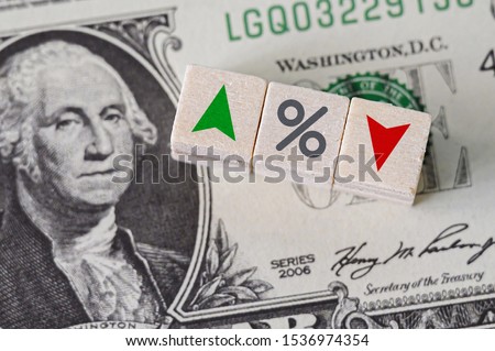 Concept idea of FED, federal reserve system is the central banking system of the united states of america and change interest rates. Percentage icon and arrow symbol on wooden cube