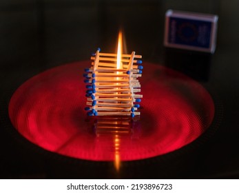 Concept Idea With Matchsticks On The Electric Stovetop For Global Energy Crisis