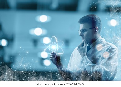 Concept of idea in science. A young scientist looks at a luminous light bulb with an atom inside.