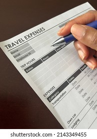 A Concept Image Of A Black Person Completing A Travel Expense Form