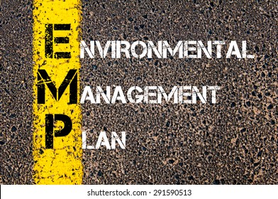 Concept Image Of Business Acronym EMP As Environmental Management Plan Written Over Road Marking Yellow Paint Line.