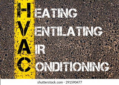 Concept image of Business Acronym HVAC as Heating Ventilating Air Conditioning written over road marking yellow paint line.