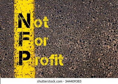 Concept Image Of Business Acronym NFP As Not For Profit Written Over Road Marking Yellow Paint Line.