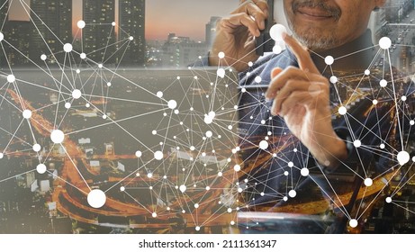 Concept Image Of Businessman On The Phone With Network Graphics And Multi Layers Overlay City Image.