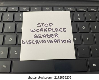 A Concept Image Of Handwritten Note On A Computer Keyboard Stating Stop Workplace Gender Discrimination