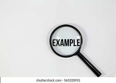 A concept image of a magnifying glass isolated white background with a word EXAMPLE zoom inside the glass 
