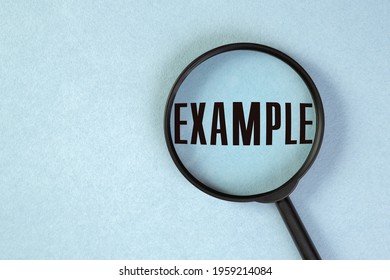 A Concept Image Of A Magnifying Glass On Blue Background With A Word EXAMPLE Zoom Inside The Glass.