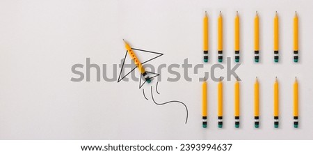 Concept image of a pencil in an airplane metaphor. Idea of leadership and education