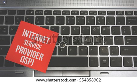 Concept Image of a red sticky note pasted on a keyboard with a message word white in color Internet Service Provider (ISP)