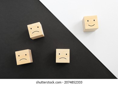 Concept image of satisfaction level. wooden cubes with emotions - Shutterstock ID 2074852333