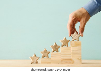 concept image of setting a five star goal.  increase rating or ranking, evaluation and classification idea - Shutterstock ID 1140456245