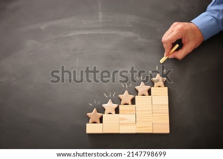 concept image of setting a five star goal. increase rating or ranking, evaluation and classification idea. Top view. Flat lay