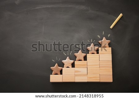 concept image of setting a five star goal. increase rating or ranking, evaluation and classification idea. Top view. Flat lay