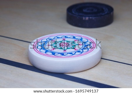 concept image of striker on the carrom board with selective focus.  