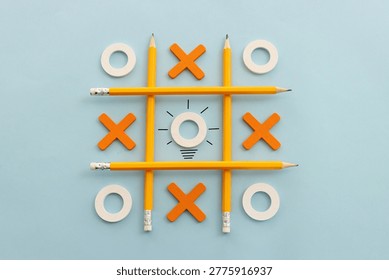 Concept image of unique thinking. Puzzle game cube in the shape of light bulb