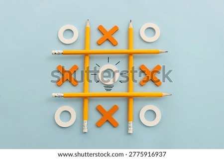 Concept image of unique thinking. Puzzle game cube in the shape of light bulb