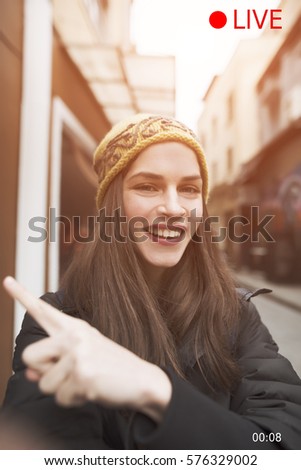concept image of vertical video caption, a beautiful young woman live streaming for social media