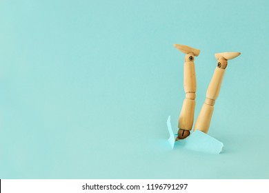 Concept Image Of Wooden Dummy Stuck Upside Down.  Stress And Danger Concept. 