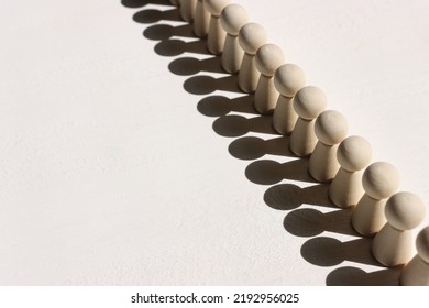 Concept Image Of Wooden Figures Forming A Wall. Leadership Teamwork And Strength Metaphor