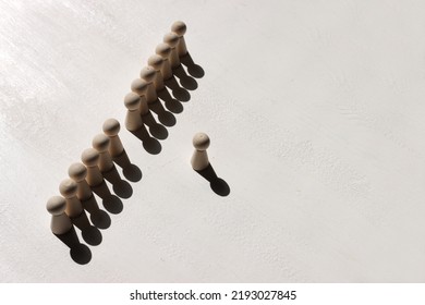 Concept Image Of Wooden Figures Forming A Wall. Leadership Teamwork And Strength Metaphor