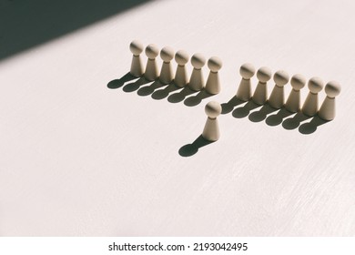 Concept Image Of Wooden Figures Forming A Wall. Leadership Teamwork And Strength Metaphor