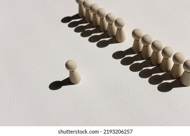 Concept Image Of Wooden Figures Forming A Wall. Leadership Teamwork And Strength Metaphor