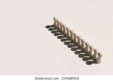 Concept Image Of Wooden Figures Forming A Wall. Leadership Teamwork And Strength Metaphor