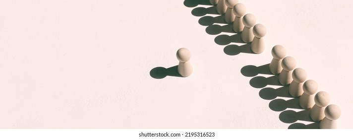 Concept Image Of Wooden Figures Forming A Wall. Leadership Teamwork And Strength Metaphor