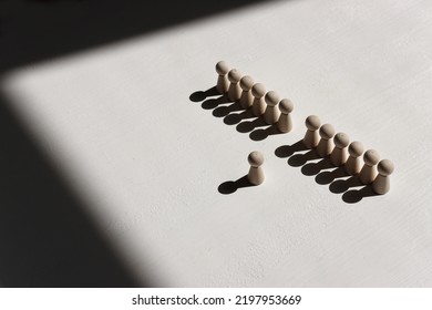 Concept Image Of Wooden Figures Forming A Wall. Leadership Teamwork And Strength Metaphor