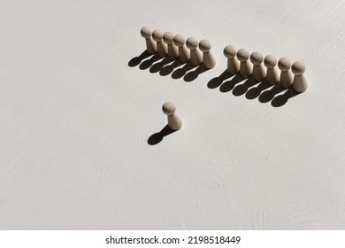 Concept Image Of Wooden Figures Forming A Wall. Leadership Teamwork And Strength Metaphor