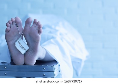 Concept Imitation Morgue, Coronavirus Victim Killed By 2019-ncov, Legs Of A Corpse On A Table, Man Died