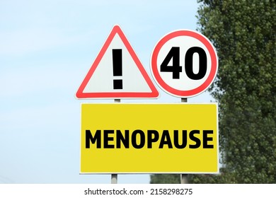 Concept of impending menopause at 40 years old. Post with dIfferent signs outdoors - Shutterstock ID 2158298275