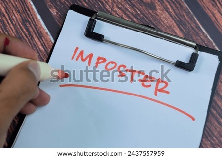 Concept of Imposter write on paperwork isolated on wooden background.