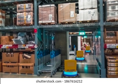 Concept Industry 4.0 Robotic Artificial Intelligence,Autonomous Robot Of Warehouse Logistic,smart Automated Delivery Vehicle In Modern Storehouse Shipping,with Robot Carrier Carrying Cardboard Box