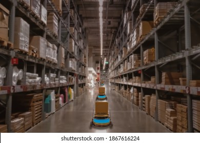 Concept Industry 4.0 Robotic Artificial Intelligence,Autonomous Robot Of Warehouse Logistic,smart Automated Delivery Vehicle In Modern Storehouse Shipping,with Robot Carrier Carrying Cardboard Box