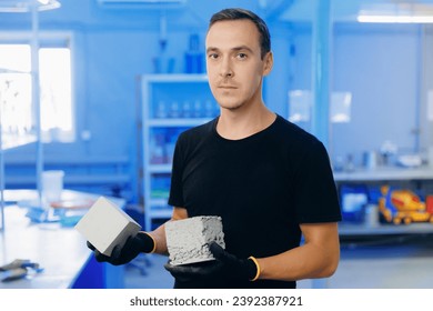 Concept industry lab for testing building materials. Worker engineer measures and controls quality of concrete cube in laboratory. - Powered by Shutterstock