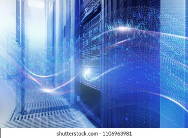 The concept of information technology, big data, security and hacking. The waves of binary code cover the data center disk storage. room with rows of server hardware in the data center