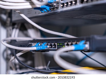 Concept of infrastructure with cables connected to data center Network switch and ethernet cable in rack cabinet.