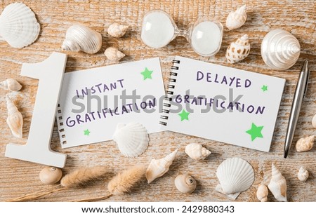 Concept of instant gratification versus delayed gratification. Text on paper decorated with seashells indoors studio shot.