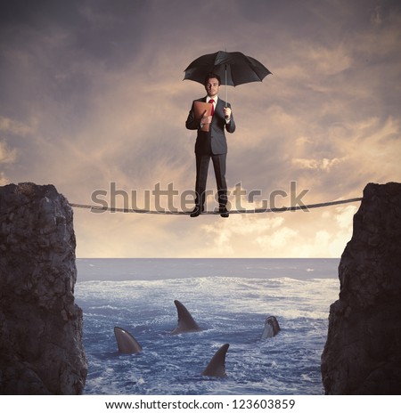 Concept of insurance with businessman on the rope