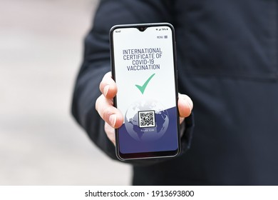 Concept For International Corona Virus Vaccine Passport On Mobile Phone Device To Allow Vaccinated People Privileges