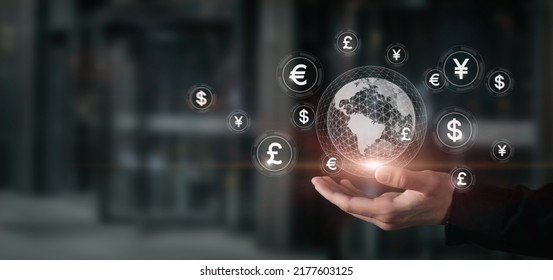 Concept of international currency market. Businessman hand shows globe and currency.